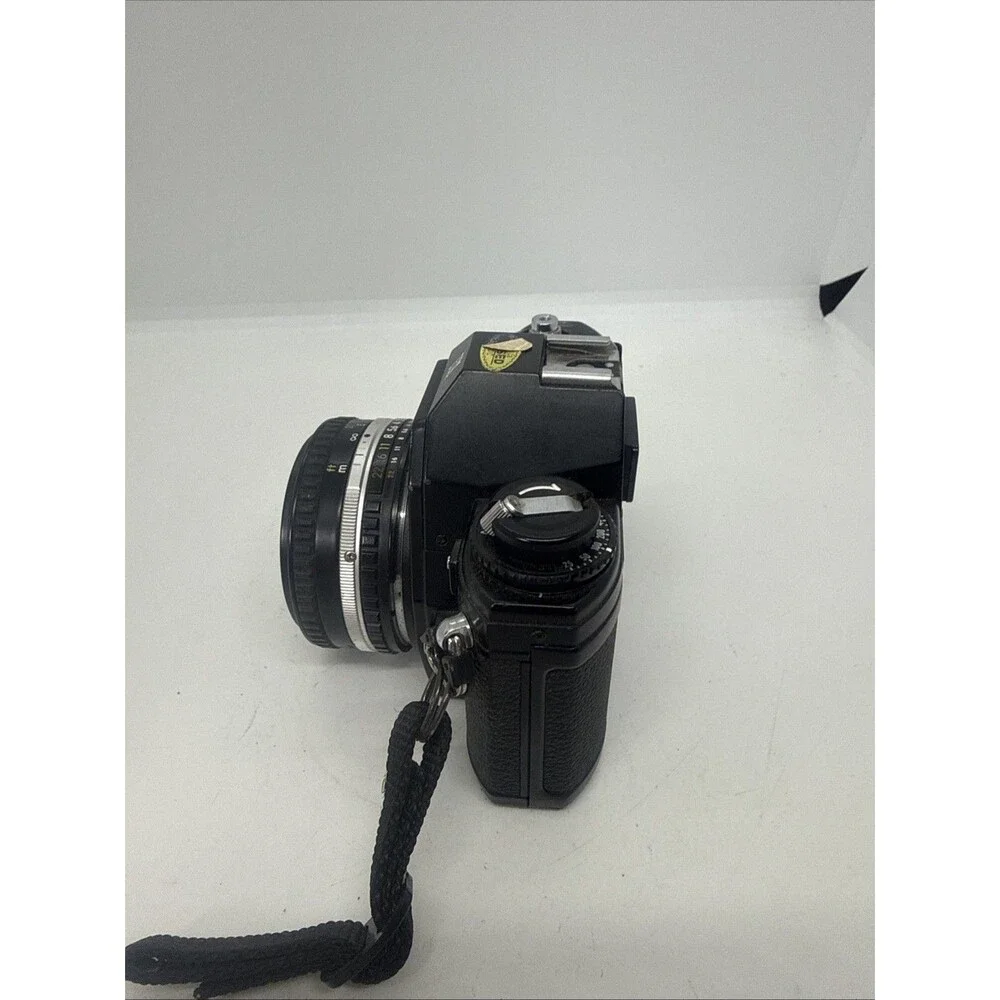 Vintage Nikon EM Black SLR Film Camera with Nikon Lens